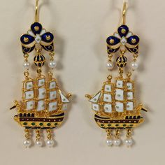 Museum copy caravel shaped earrings made of 18 ct. solid yellow gold decorated with colorful handmade hot enamel and pearls, made in Greece in Athens Each earring is made of 33 different pieces, as you can see in the photo, most of the pieces are different between the left and the right earring It' s a perfect reproduction of an antic pair of earrings The original is exposed at the Benaki museum in Athens and belongs to the most famous and discussed jewelry in Greece Post - Byzantine and modern Luxury Yellow Gold Enamel Earrings, Formal Enamel Earrings Hallmarked, Hallmarked Gold Enamel Earrings, Luxury Hallmarked Enamel Earrings, Gold Enamel Pierced Earrings, Handmade Enamel Earrings For Formal Occasions, Handmade Gold Enamel Earrings, Gold Earrings With Black Enamel, Gold Enamel Earrings With Black Detail