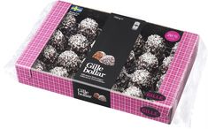 a box of chocolate truffles with white sprinkles on it's wrapper