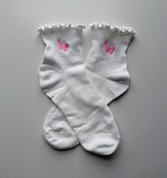 Show your feminine side with these beautiful coquette inspired socks. They have a cute ruffle design by the cuff and are ankle length.  Comfortable for all day wear with plenty of stretch.  Women's shoe size 5-9 Made with 76% cotton Cute Ruffled Socks For Spring, Pink Ruffled Socks For Spring, Casual Ruffled Socks For Spring, Casual Ruffle Socks For Spring, White Ruffled Socks For Summer, Cute Cotton Socks For Spring, Cute Pink Ruffled Socks, Trendy Ruffled Socks For Spring, White Knee-high Socks For Spring