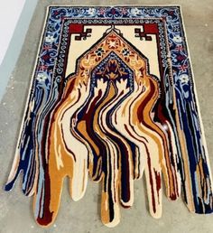 an area rug with different colors and designs on it