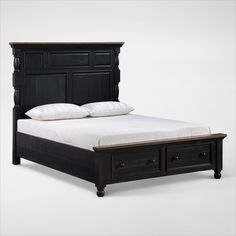 a black bed with two drawers underneath it