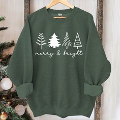 Christmas Tree Sweatshirt, Womens Christmas Sweatshirt, Christmas Sweater, Christmas Crewneck, Holiday Sweaters for Women, Winter Sweatshirt Suitable for many occasions such as Christmas, Father's Day, Mother's Day, birthday This classic crew-neck sweatshirt is an essential basic item for anyone’s wardrobe. The ribbed cuffs on the sleeves and waist are reinforced, and the high-quality cotton ensure that anyone will enjoy this cuddly and cool sweatshirt for many moons to come. Preshrunk fleece kn Sweatshirt And Shirt Outfit, Christmas Sweatshirt Ideas, Sweaters For Women Winter, Vintage Christmas Sweaters, Holiday Sweaters, Preppy Christmas, Christmas T Shirt Design, Womens Christmas, Christmas Crewneck