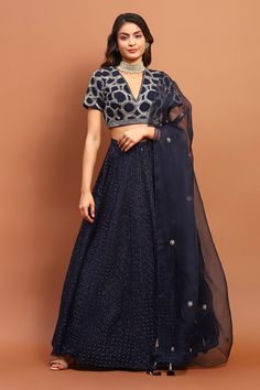 Navy blue attached cancan lehenga with thread, sequin embroidery in circle pattern. Paired with half sleeve padded blouse and dupatta. Components: 3 Pattern: Embroidery Type Of Work: Thread, sequin, circle Neckline: V neck Sleeve Type: Half Fabric: Georgette Color: Blue Other Details:  Tassel bordered sheer dupatta Occasion: Destination Wedding - Aza Fashions V Neck Lehenga, Cape Lehenga, Cancan Lehenga, Sheer Dupatta, Kurta Lehenga, Padded Blouse, Lehenga Skirt, Embroidered Lehenga, Tarun Tahiliani