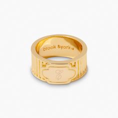 Add a unique, edgy touch to your ensemble with Harlow—a one-of-a-kind gold ring, custom to your exact specifications! Let your style shine and give your look a high-fashion edge. Available in 14k gold plated brass Size: 1/2" Band Width: 10mm Protected with an anti-tarnish barrier With engraving this item is FINAL SALE SKU: BYR1119 Elegant Gold Engraved Ring In Brass, Classic Gold Stackable Brass Rings, Gold Luxury Engraved Ring, Luxury Gold Wide Band Stackable Rings, Luxury Gold Wide Stackable Rings, Timeless Gold Stackable Rings With Wide Band, Classic Gold Initial Ring With Open Band, Gold Thick Band Engraved Ring, Timeless Gold Jewelry With Polished Edges