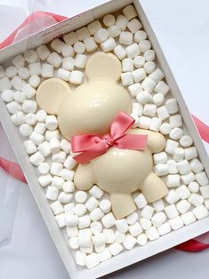 a white box with marshmallows in the shape of a teddy bear