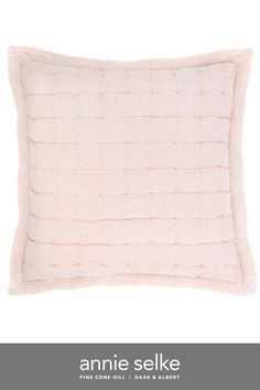 an image of a pink pillow with the words annie selke on it in white