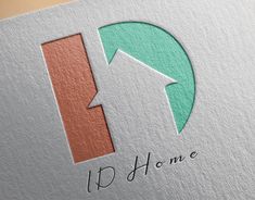 the logo for i d home with an arrow pointing up to it's right