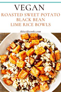 a white bowl filled with rice, beans and sweet potato salad on top of a wooden table