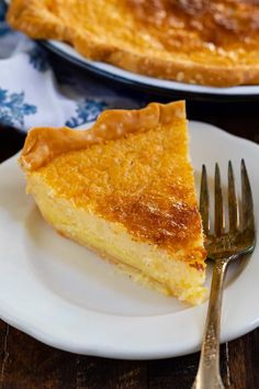 a slice of buttermilk pie on a plate with a fork next to it