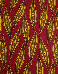 a red and yellow cloth with an intricate design on it