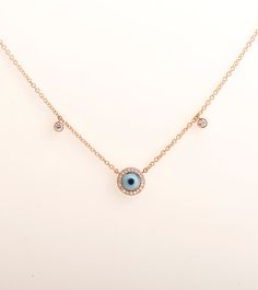 Evil eye penadant made in 14k or 18k rose gold and set with clear diamonds. Diamonds surrounding the eye and 2 additional diamonds on each side of the chain. The eye color is made in enamel coating process and can be made in other colors as well This listing is for ROSE GOLD, you can order other colours from the following links: ● Yellow gold - ● White gold - DIAMONDS SPECIFICATIONS Total Carat Weight: 0.30 CT Color: G + Clarity: VS + Shape: Round The stones are 100% natural diamonds and conflic Rose Gold Diamond Jewelry With Diamond Eyes, 14k Rose Gold Jewelry With Diamond Eyes, Rose Gold 14k Diamond Eyes Jewelry, 14k Rose Gold Single Cut Diamonds Jewelry, Elegant Rose Gold Evil Eye Jewelry, 14k Rose Gold Round Necklace Fine Jewelry, Tri Color Ring, Necklace Evil Eye, Diamonds Necklace