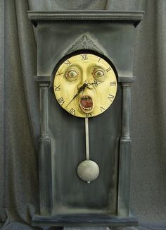 a clock with an evil face on it