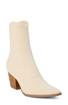 A pointy toe, Cuban heel and curvy topline reflect the Western-influenced design of this ankle boot made with a stretchy knit upper. 2 1/2" heel; 1/2" platform 8" shaft Pull-on style Textile upper/synthetic lining and sole Imported Spring Fitted Almond Toe Booties, Cream Fitted Almond Toe Boots, Cream Almond Toe Fitted Boots, Cream Colored Fitted Heeled Boots With Pointed Toe, Cream Pointed Toe Fitted Boots, Fitted Cream Boots With Pointed Toe, Fitted Cream Pointed Toe Boots, Spring Fitted Cream Heeled Boots, Fitted Cream Heeled Boots For Spring