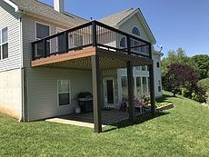 a house that has a deck on the side of it