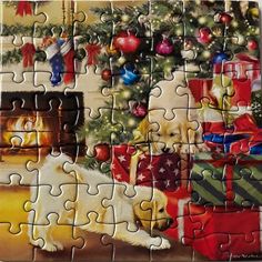 a jigsaw puzzle with a christmas tree and two puppies on it's side