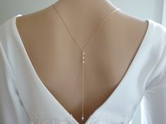 Accentuate your low back gown with this dainty pearl backdrop bridal necklace.  A single 8mm crystal pearl in front compliments the 6 inch back drop which includes a linear 3 pearl mid back design perfect for your minimalist wedding. Measures 26 inches in diameter and fits over the head, if your wedding look requires an updo hairstyle make sure to place the necklace on first.   The back drop detail measures 6 inches in length. Chain offered in either  14kt. Gold filled or Sterling silver. Weddin Pearl Back Necklace, Bridal Necklace Pearl, Backdrop Necklace Wedding, Minimalist Wedding Jewelry, Simple Backdrop, Bridal Backdrop Necklace, Backdrop Necklace, Pearl Cluster Earrings, Gold Bridal Necklace