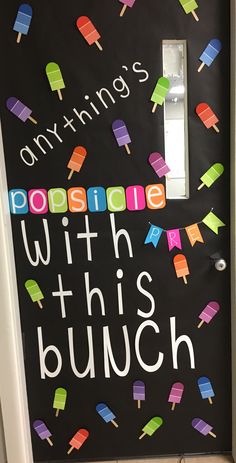 a door decorated with ice cream and popsicles that says, anything's possible with this bunch