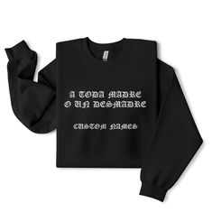 La Onda "A Toda Madre O Un Desmadre" Embroidery Streetwear Shirt, Sweater or Hoodie - Custom Vatos Locos Forever Personalized Gift ----------------- Embroidery in Old English "A Toda Madre O Un Desmadre" We can also customize the sweater for your names of friends, family and coworkers. NOTE: This personalization is optional. ----- Brand: Unisex Kree8tions Apparel  100% cotton Sport Grey is 90% cotton, 10% polyester Ash Grey is 99% cotton, 1% polyester Heather colors are 50% cotton, 50% polyester Fabric weight: 5.0-5.3 oz/yd² (170-180 g/m²) Pre-shrunk jersey knit Open-end yarn Tubular construction Taped neck and shoulders Double seam at sleeves and bottom hem Tear-away tag ----- Hoodie Unisex Heavy Blend Hoodie | Gildan 50% pre-shrunk cotton, 50% polyester Fabric weight: 8.0 oz/yd² (271.25 Customizable Long Sleeve Winter Outerwear, Customizable Cotton Long Sleeve Outerwear, Black Embroidered Text Sweater For Fall, Custom Text Long Sleeve Sweatshirt For Winter, Customizable Winter Hoodie Tops, Black Sweater With Embroidered Text For Fall, Fleece Tops With Embroidered Text For Streetwear, Custom Text Long Sleeve Tops For Streetwear, Black Embroidered Tops For Winter