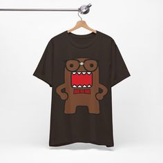 Unisex Nerd Domo Kun Tee - Emo Scene Style Shirt - Vintage Domo Face 2000's Fashion Hot Topic This classic unisex jersey short sleeve tee fits like a well-loved favorite. Soft cotton and quality print make users fall in love with it over and over again. These t-shirts have-ribbed knit collars to bolster shaping. The shoulders are tapered for a better fit over time. Dual side seams hold the garment's shape for longer.  .: Made with 100% Airlume combed and ring-spun cotton, a lightweight fabric (4.2 oz/yd² (142 g/m that is easy to layer, breathable. Perfect for active and leisure wear.  .: The retail fit that is perfect for casual and semi-formal settings. The crew neckline adds a classic, neat style that's perfect for accessorizing. .: Bella+Canvas manufactures all its products in the US an Domo Kun Clothes, Domo Shirt Y2k, Emo Style 2000s, Emo T-shirt With Character Print, Skelanimals Shirt, Cheap Emo Fan Merchandise T-shirt, Shirt Drawing, Scene Fashion, Emo Fashion