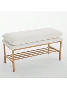 a wooden bench with a white cushion on it