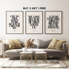 three black and white art prints on the wall above a couch with two coffee tables