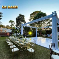 an outdoor event setup with tables and chairs