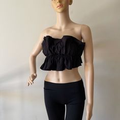 New Without Tags Black Ruffle Tied Back Crop Top Size S 72% Rayon 24% Nylon 4% Spandex Stretch Cotton Crop Top For Brunch, Black Bandeau Top For Spring, Fitted Ruffle Tube Top Casual Style, Chic Cotton Tube Top For Night Out, Black Bandeau Crop Top For Spring, Fitted Casual Tube Top With Ruffles, Casual Fitted Tube Top With Ruffles, Stretch Flirty Crop Top For Day Out, Black Ruffled Crop Top For Spring