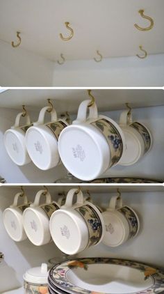 three pictures of coffee cups and saucers hanging from hooks on the ceiling above them