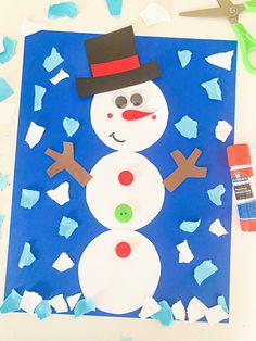 paper plate snowman craft with scissors and glue