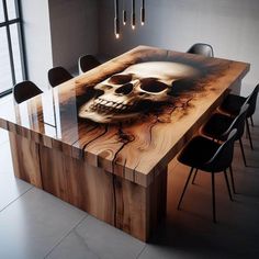 a wooden table topped with a skull on it's face next to black chairs