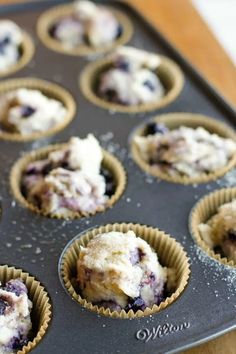 blueberry muffins are in the pan ready to be baked