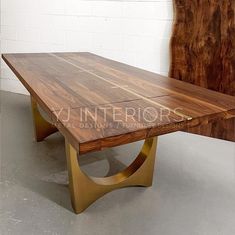 a large wooden table sitting on top of a white floor