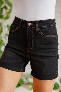 The Avery Hi Waist Cuffed Denim Shorts have all the qualities you're looking for and more! Featuring a washed black, stretchy denim that shapes a high-rise waist with a five-pocket cut and zipper fly. Lived in fading decorates these cute shorts, ending at a cuffed hem. These can be worn cuffed or uncuffed. Judy Blue 4-Way Stretch + Hi-Rise Cuffed + Contrasting brown stitching 65% Cotton, 21% Rayon, 11% Polyester, 3% Spandex Wash Cold, Hang Dry True to size Measurements listed below are of the ac Cuffed Denim Shorts, Black Slippers, Judy Blue Jeans, Cute Shorts, Sweater Vest, Christmas Outfit, Boutique Clothing, Clothing Items, Sweater Top