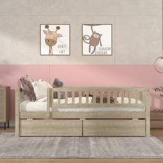 a baby's room with pink walls and two pictures on the wall above the crib