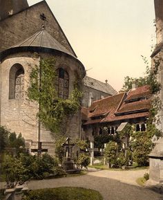 an old photo of a building with ivy growing on it