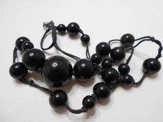 "Vintage black plastic beaded necklace. 28\" long. Spring fastener. Rope style chain. Pretty! Excellent condition. Unsigned." Black Beaded Necklace For Formal Costume Jewelry, Black Beaded Costume Jewelry Necklace For Formal Occasions, Black Beaded Necklace With Large Beads For Formal Occasions, Formal Black Beaded Costume Jewelry Necklace, Black Beaded Necklace With Round Beads, Black Beaded Long Necklace With Round Beads, Black Beaded Necklaces Costume Jewelry, Elegant Black Beaded Necklace With Wooden Beads, Black Long Necklace With Round Beads