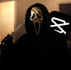 a person wearing a mask and holding a knife with the word scream written on it