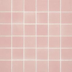 a pink tiled wall with white squares on it