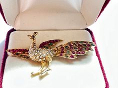 Antique 14k yellow gold peacock with pearl, ruby , emerald, & sapphire brooch / pin ( P76) C clasp Victoria era generally use 1850-1910 Weight 8.9 gram  2.25 in x 1.15 in It's a handcraft antique piece, there is no marking , metal tested to be 14k yellow gold. Elegant Multi-stone Brooches For Gifts, Wedding Brooch With Peacock Design, Fine Jewelry Gold Brooches With Multi-stone, Gold Brooches With Peacock Design As Gift, Gold Multi-stone Fine Jewelry Brooches, Elegant Wedding Brooch With Peacock Design, Elegant Festive Jewelry With Brooch Detail, Elegant Festive Jewelry With Brooch, Elegant Peacock Design Brooch For Formal Occasions