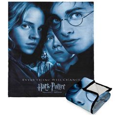 the harry potter movie poster is next to an eyeglass case with glasses on it