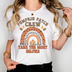 Get ready for fall fun with our Pumpkin Patch Crew "Most Likely To" shirts, perfect for family outings and group adventures. These cozy and stylish shirts feature humorous "most likely to" sayings, making them the ideal choice for pumpkin patch visits, hayrides, and all your autumn activities. - PREMIUM UNISEX T SHIRT - Bella & Canvas 3001 - Unisex Jersey Tee - Durable, soft, and printed using high quality techniques that will leave you with a lasting product. - HOW TO ORDER -  1.Select the SHIRT COLOR 2.Select the SIZE  3.     Tell us what saying you want (you can customize your own!) 4.Choose quantity 5.Add to Cart & Check out! SOME SHIRT SAYING IDEAS: Most Likely to Jump in a Haystack Most Likely to Carve a Masterpiece Most Likely to Drink All the Cider Most Likely to Pet All the Animal Most Likely To Shirts, Washing And Drying Machine, Patch Shirt, Patches Shirt, Pumpkin Picking, Bunny Designs, Fall Photoshoot, Pumpkin Shirt, Fall Shirt