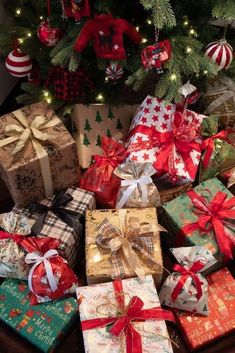 many wrapped presents under a christmas tree