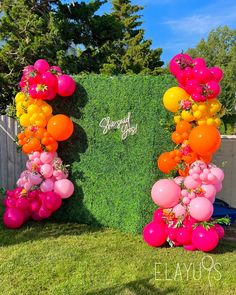 Bridal shower grass backdrop with colorful pink, orange and yellow balloons. Summer display Tiki Backdrop Ideas, Orange Pink Garland, Pink Orange Yellow Balloons, Bright Pink Party Decorations, Balloon Garland Bright Colors, Hawaiian Theme Balloon Garland, Bright Colorful Centerpieces, Pink Orange Yellow Balloon Garland, Pink Yellow Orange Balloon Arch