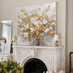 a living room with a fire place and a painting on the fireplace mantels