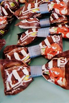 several bags of candy are laid out on a table