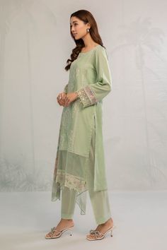 Sea Green Embroidered Pakistani Salwar Kameez with Dupatta Salwar Suit in Classical Dobby Lawn that is an elegant masterpiece that will give you a stunning look with a contrast of sea green color. Hand-crafted embellishments and threads make this kameez and trousers style Dress an epitome of beauty and your foremost priority for the functions. Embroidered Kameez: The beautiful kameez is gracefully Hand embellished, with floral designs. Hand-crafted details of motifs and sequins enhance the charm Pista Green Silk Churidar With Chikankari Embroidery, Elegant Pista Green Cotton Silk Kurta, Unstitched Pista Green Cotton Silk Sharara, Pista Green Cotton Silk Kurta For Eid, Eid Kurta With Intricate Embroidery In Cambric, Green Cotton Silk Set With Intricate Embroidery, Eid Cambric Kurta With Intricate Embroidery, Straight Kurta Lawn Suit With Intricate Embroidery In Cambric, Eid Sharara With Intricate Embroidery In Cambric