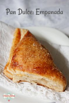 a close up of a piece of food on a plate with the words pan dulce empanada