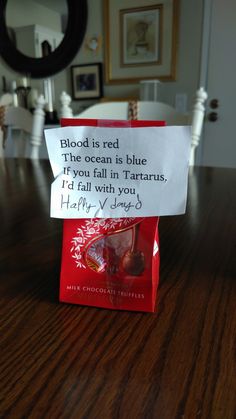 a red bag with a note attached to it