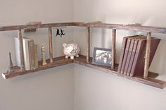 a corner shelf with some books and a pig figurine on the top one