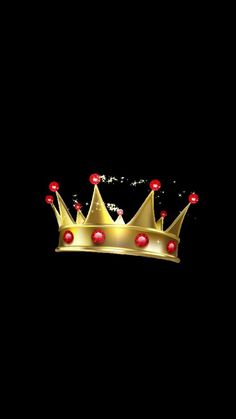 a gold crown with red jewels on it